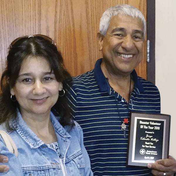 Jorge Taborda, right, and his wife, Francia Benitez, pose for photo after he received the Red Cross volunteer of the year award in 2016.