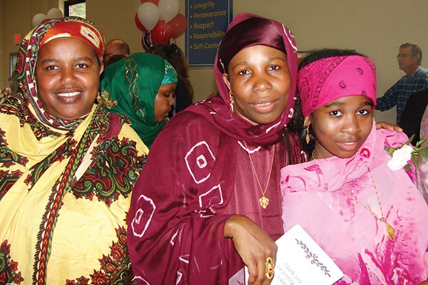 Former refugee Madina Dhahir Haji celebrated her eighth-grade graduation in 2009 with her mother, Zahara.