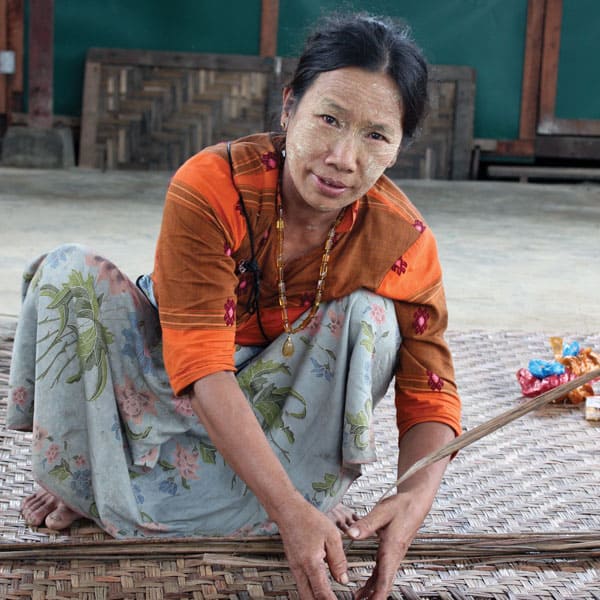 Mercy messenger:A woman displaced by fighting in north Myanmar (formerly Burma) weaves a mat in a refugee camp.