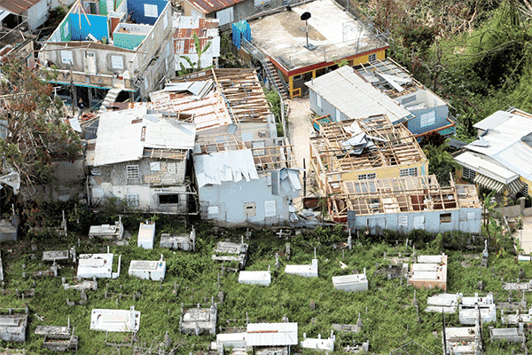 Destroyed homes next to a cemetery in Morovis, Puerto Rico. Months after Hurricane Maria, the situation remains dire. (CNS/Puerto Rico)