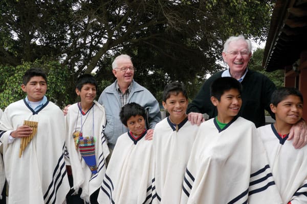 Maryknoll Fathers Bernard "Pete" Byrne (right) and Philip Erbland visiting residents at Santa Maria Home for Boys in Lima in 2009. Inspired by the work of Maryknoll Father Byrne, a group of Peruvian Maryknoll Affiliates continue supporting vulnerable children in the peripheries of Lima, Peru.