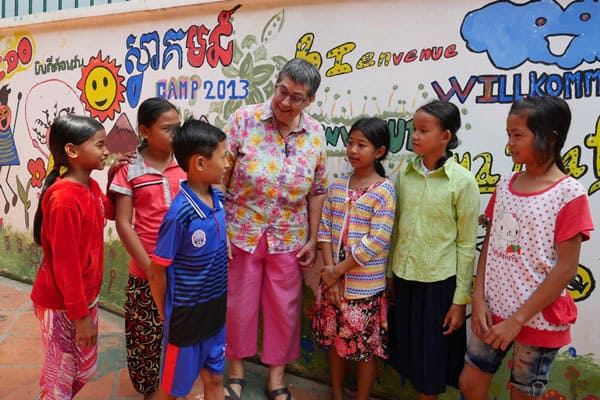 Maryknoll Cambodia: Maryknoll Sister Ann Sherman, above, is surrounded by students from her English class for underprivileged Cambodian children. (S. Sprague/Cambodia)