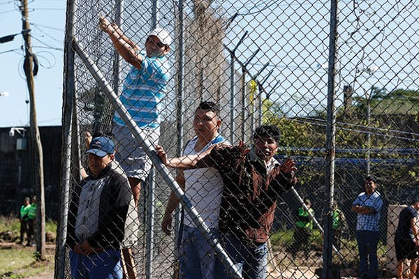 Inmates at a Bolivian prison in strain to see Pope Francis during his 2015 visit to that country, where a Maryknoll priest works in prison ministry focused on forgiveness.