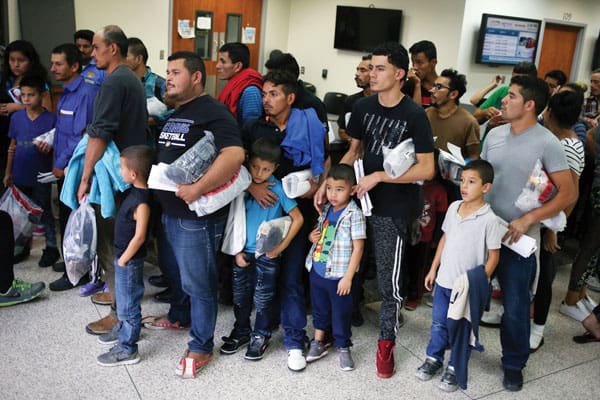 Separated migrants released from detention in McAllen,Texas, are reunited with their children but these families face a future of ongoing fear and uncertainty. (CNS/L. Elliott, Reuters/U.S.)
