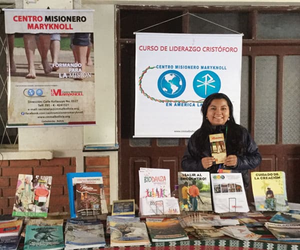 Silvana Martínez, a member of the Maryknoll Missionary Center for Latin America, staffed a booth at V CAM displaying Maryknoll resources for mission education and formation.