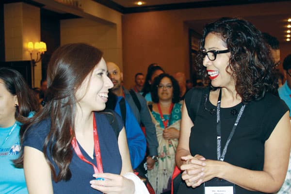 Lily Morales (left), coordinator of Hispanic ministry in Austin, Texas, shares ideas and finds solidarity with other Catholic Hispanic leaders like Natalia Moreau. (G. Soria/U.S.)