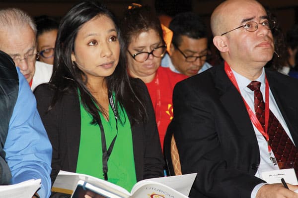 Edith Avila Olea, coordinator of young professionals for Catholic Charities in the Diocese of Joliet, Ill., listens intently with other participants at V Encuentro. (G. Soria/U.S.)