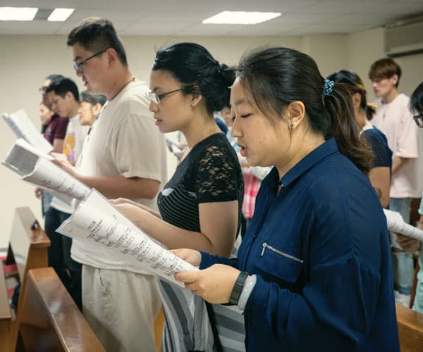 Father Doyle Helps Foster Catholic Friendship and Love in Taiwan: Singles worship at Saturday night Mass in the chapel at Friendship House in Taipei. (Nile Sprague/Taiwan)