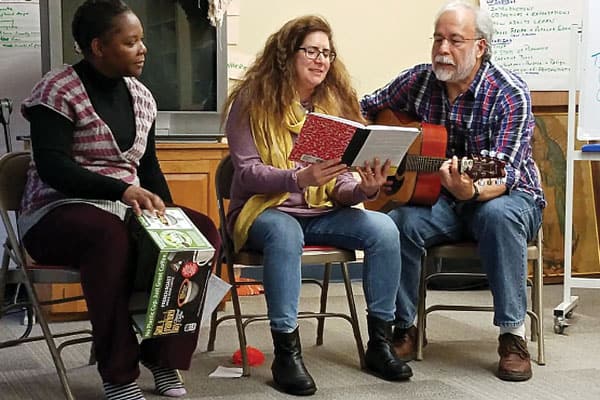 13 Missioners sent forth: (From left) Sister Armeline Sidoine, Verónica Arriagada and José Luís Aguilar practice hymns for Mass during their 10-week orientation. (M. Scherer-Emunds/U.S.)