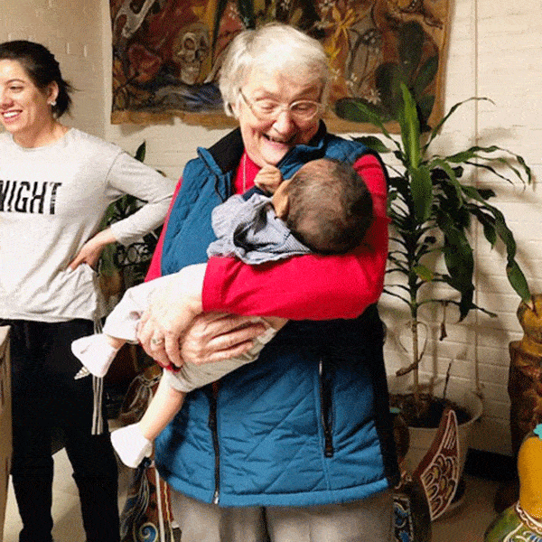 Sister Rancourt cuddles a baby at San Juan Diego Center. (Courtesy of Maryknoll Sisters)