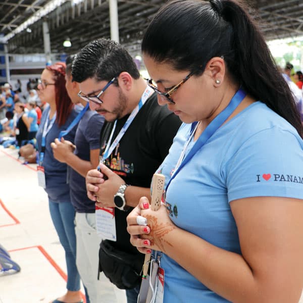 World Youth Day, 2019: Ernesto and Andrea Lopez, pilgrims from El Salvador, pray during a morning catechesis. (M. Chin/Panama)