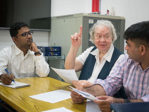 AHRC and Maryknoll Sister: As an editor at the Asian Human Rights Commission in Hong Kong, Maryknoll Sister Marya Zaborowski confers with co-workers as they raise awareness of human rights violations and assist victims of abuse in Asia.