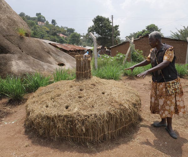 Natalia Kadio, director of Mabatini Public Health Center, a holistic ministry of Transfiguration parish in Mwanza, Tanzania, shows a raised garden bed that was recently seeded with medicinal plants as part of efforts to promote health and well-being.