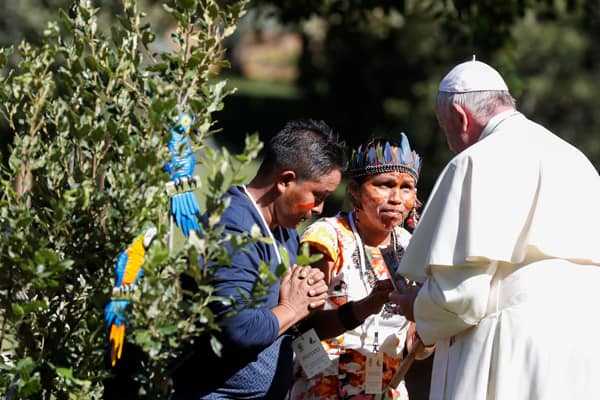 Pope Francis greets members of an indigenous community of the Amazon during a celebration marking the feast of St. Francis in the Vatican Gardens Oct. 4, 2019. Pope Francis called on participants to listen and discern "guidance of the Holy Spirit." (CNS/Yara Nardi, Reuters)