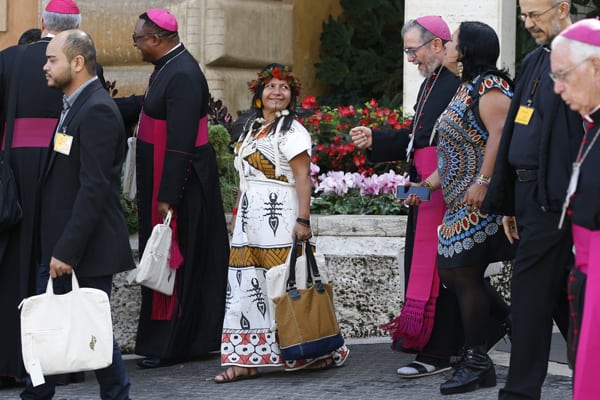Bishops and lay participants leave the first session of the Synod of Bishops for the Amazon at the Vatican Oct. 7, 2019. The first week of the Synod of Bishops for the Amazon saw support for key synod themes emerge, including the priestly ordination of married indigenous men, impassioned pleas for respect for indigenous culture and denunciations of violence against the Earth.(CNS/Paul Haring)