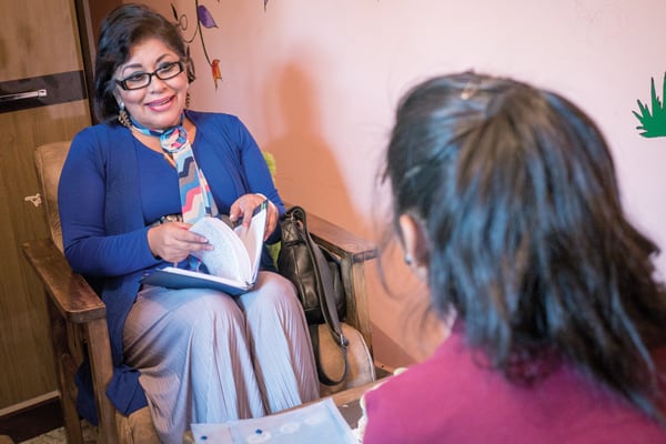 At Hogar Nuestra Casa, Dr. Elizabeth Patiño Durán, psychotherapist, evaluates a young girl who was abused by her father repeatedly until she entered the shelter four years ago. (Nile Sprague/Bolivia)