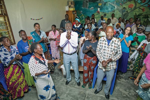 After a support group meeting, members of Uzima Centre sing a praise song: "May he be lifted up, our God, today. May he be lifted up, the Lord of lords." (J. Fleury/Tanzania)