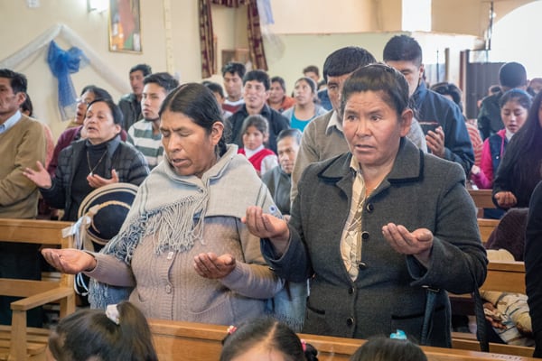 Villagers from the Andean community of Jayllihuaya in Puno, Peru, pray the Lord's Prayer in the Aymara language during the annual All Saints' Mass. (N. Sprague/Peru)