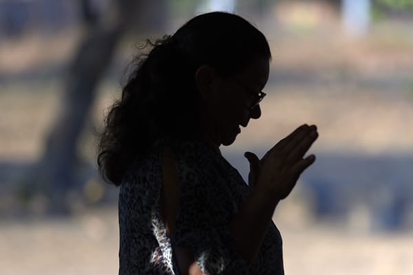 A woman prays during Mass April 6, 2019, in St. Ignatius, Guyana. Discussions at the Amazon Synod have enlarged to include the theology of creation, "where the Word of God resides." (CNS Photo/Paul Jeffrey)