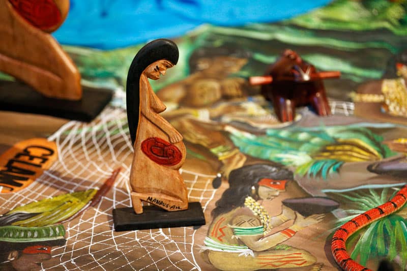 A wooden statue of a pregnant woman is displayed at the Church of Santa Maria in Traspontina in Rome in October 2019. The church near the Vatican hosted exhibits on the Amazon region during the Synod of Bishops for the Amazon. (CNS photo/Paul Haring)