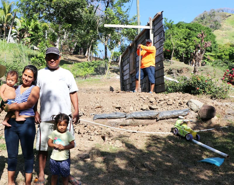 The Franco family shows the sister Heramil the land where They will build their new house.