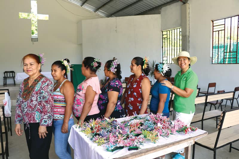 Women from the community of Vallecito show handicrafts they learned to make to sell locally.