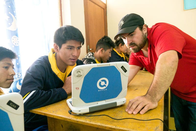 Volleyball Values: Juan Gomez teaching Jesus Puma in computer class. (Nile Sprague/Bolivia)