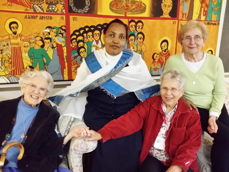 At a Maryknoll Mission Institute program (l. to r.) Maryknoll Sister Madeline Dorsey, Missionary Sister of the Sacred Heart Sister Adanech from Ethiopia, Maryknoll Affiliate Charlotte Cook and Maryknoll Sister Josephine Kollmer participate in a small group. (Courtesy of Maryknoll Sisters/U.S.)