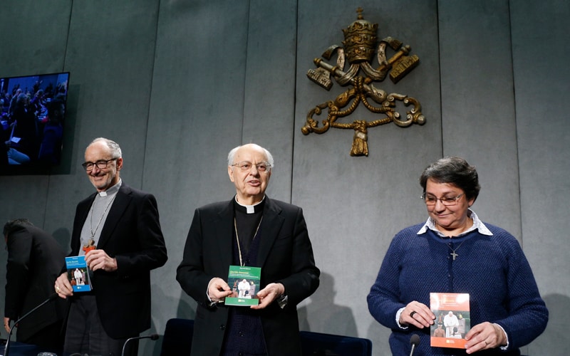 Querida Amazonia: Cardinal Michael Czerny, Cardinal Lorenzo Baldisseri, and Sister Augusta de Oliveira hold copies of Pope Francis' apostolic exhortation, "Querida Amazonia" (Beloved Amazonia), during its release at a news conference at the Vatican Feb. 12, 2020. The document contains the pope's conclusions from the 2019 Synod of Bishops for the Amazon. (CNS photo/Paul Haring)