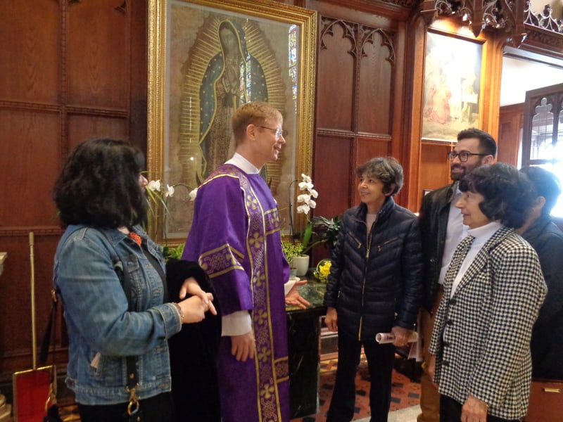 After assisting at Sunday Mass at St. Ita’s parish in Chicago, where he served as a deacon, Gregory McPhee greets some parishioners. (Courtesy of Gregory McPhee)