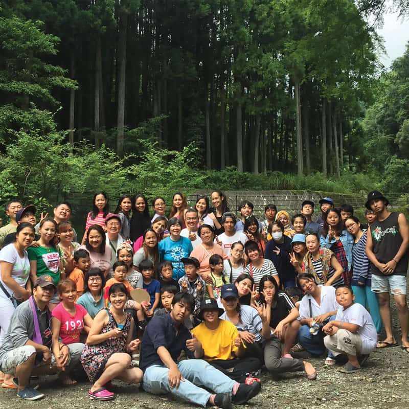 Staff and volunteers of a center for the empowerment of abused women in Japan, at an outing with the women's families. (Courtesy of Kalakasan Center)