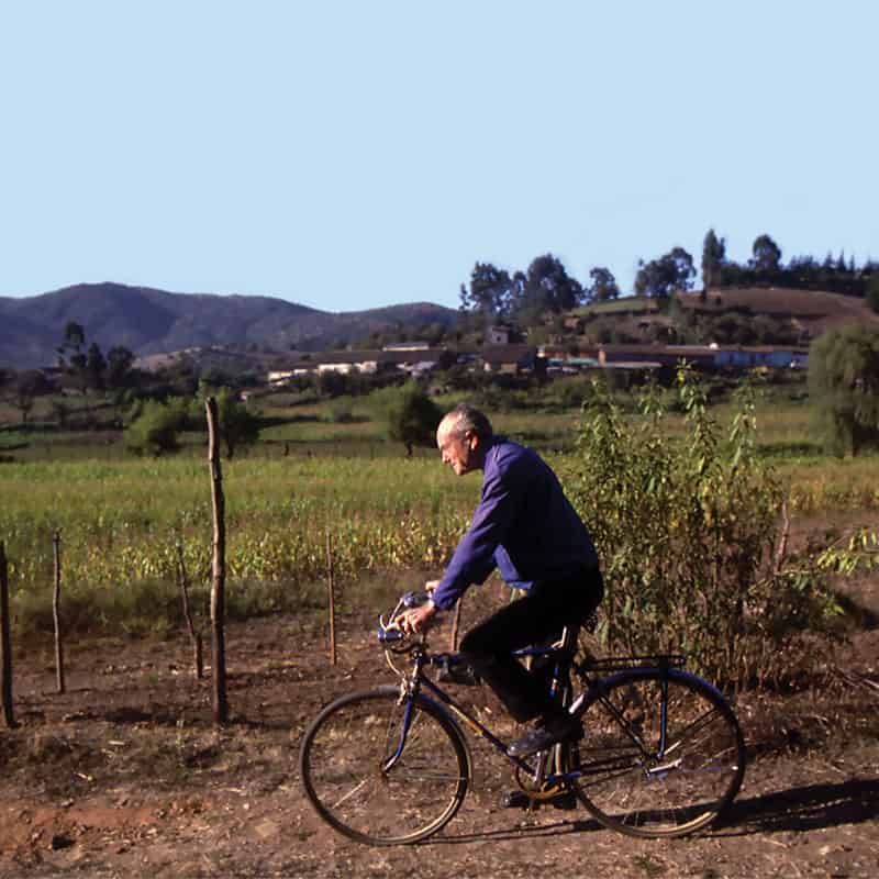 Riding over dirt roads to visit parishioners in remote areas earned Father Joseph Cappel the moniker “Bicycle Priest.” (Maryknoll Mission Archives/Chile)