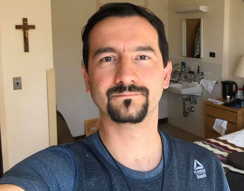 Maryknoll Father Rodrigo Ulloa during his quarantine in his room at the Maryknoll Society headquarters in Ossining, New York.