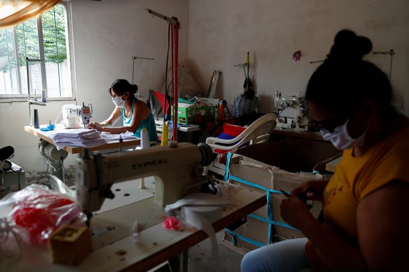 Volunteers at a soup kitchen sew protective masks for low-income people during the spread of COVID-19 in Buenos Aires, Argentina, March 26, 2020. (CNS photo/Agustin Marcarian, Reuters)