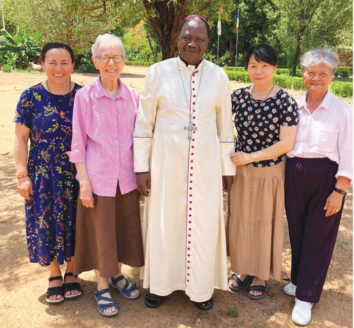 (From left to right) Sisters Norma Pocasangre, Claudette LaVerdiere, NgocHà Pham and the late Lourdes Fernandez pose with Bishop Joachim Kouraleyo of the Diocese of Moundou. (Courtesy of NgocHà Pham/Chad)