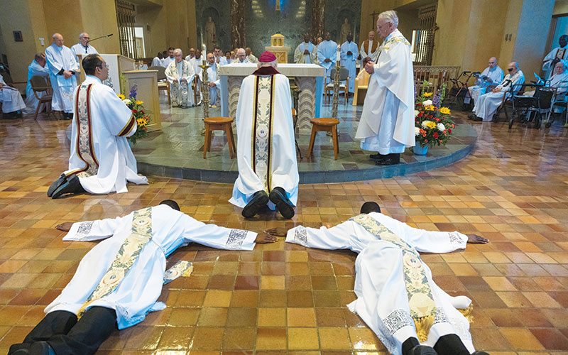 Maondo and Ogony lie prostrate during the Litany of Supplication. (Octavio Durán/U.S.)