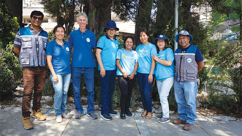 Maryknoll Lay Missioners Joe Loney (third from left) and Filo Siles (second from right) pose with Social Justice Foundation staff at the Maryknoll center. (Adam Mitchell/Bolivia)